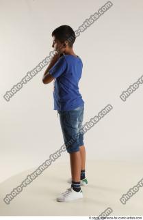 TIMBO STANDING POSE WITH GUN